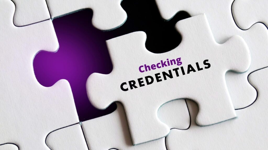 A white puzzle piece with the words "Checking CREDENTIALS" fitting into a puzzle, highlighting the importance of verifying professional qualifications.